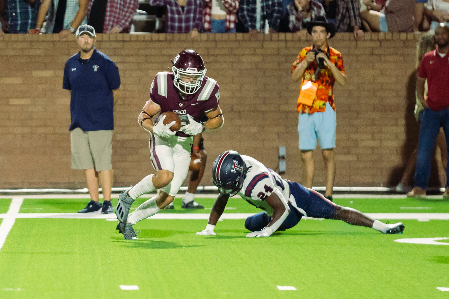 Cinco Ranch’s Seth Salverino breaks upfield after a catch during Friday’s game between Cinco Ranch and Tompkins at Rhodes Stadium.
